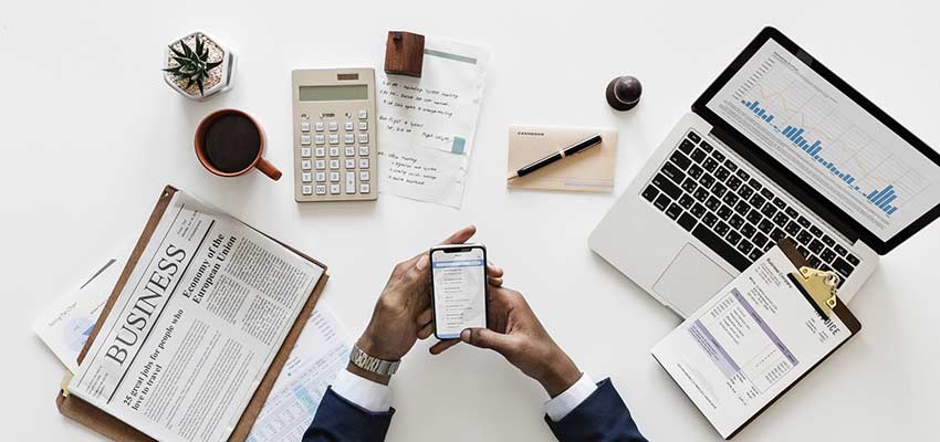 Business person with a cluttered desk