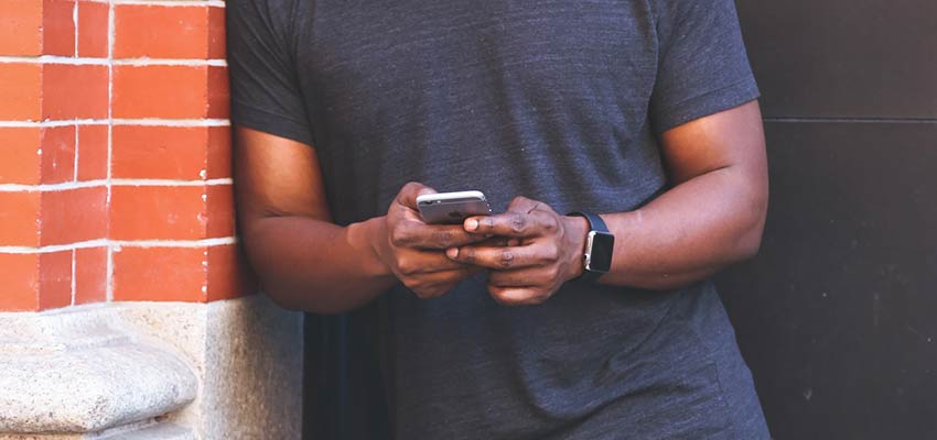 Man using an iPhone.
