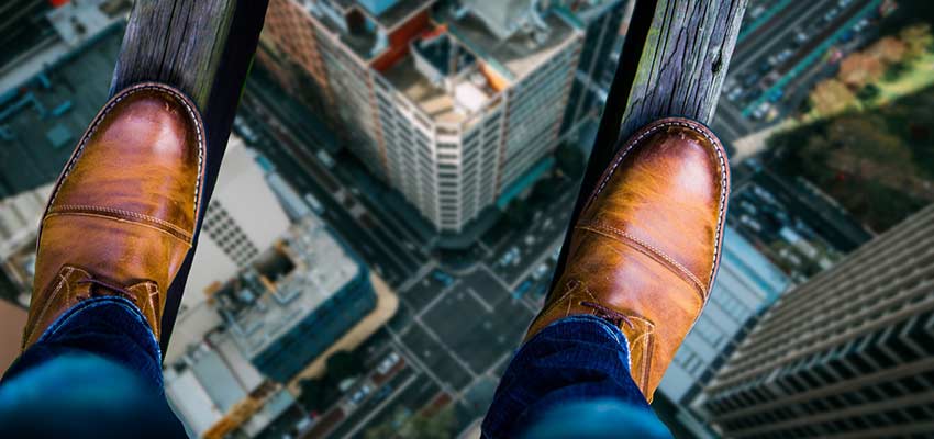 Person balanced high above a city street