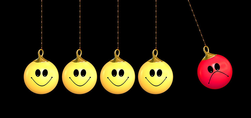 Ornaments with happy and sad faces.