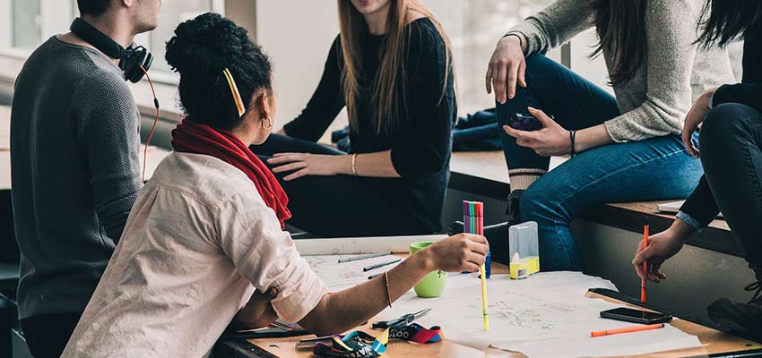A group of people at a desk.