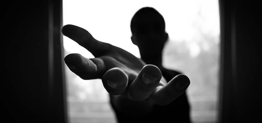 A person with a hand reaching out.