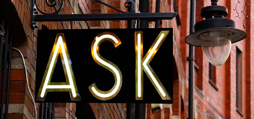 A building sign that reads "ASK".