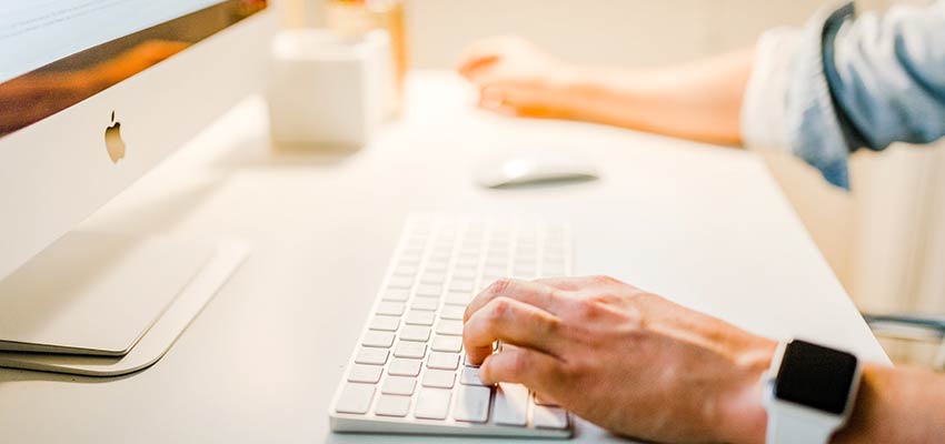 A man using a desktop computer.