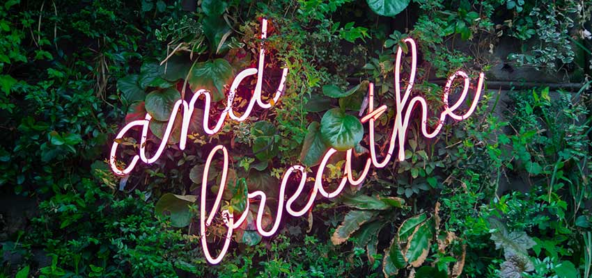 A sign that reads "And Breathe".