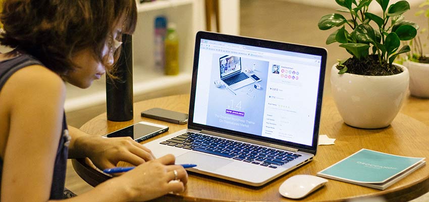 A woman using a laptop computer.
