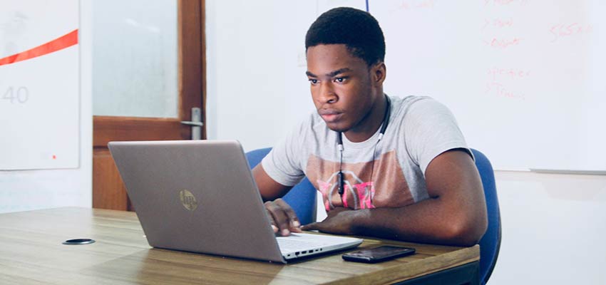 A man using a laptop computer.