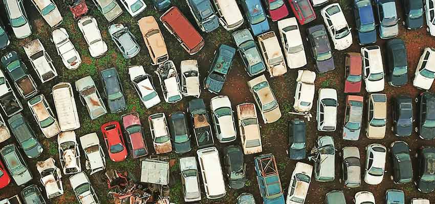 Vehicles in a junk yard.