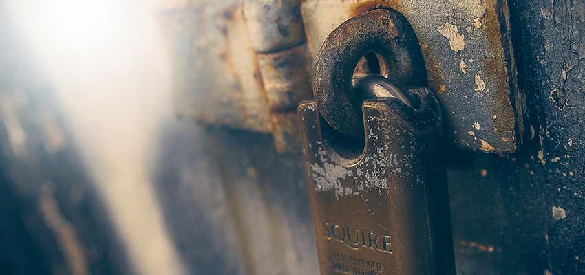 A padlock on a door.