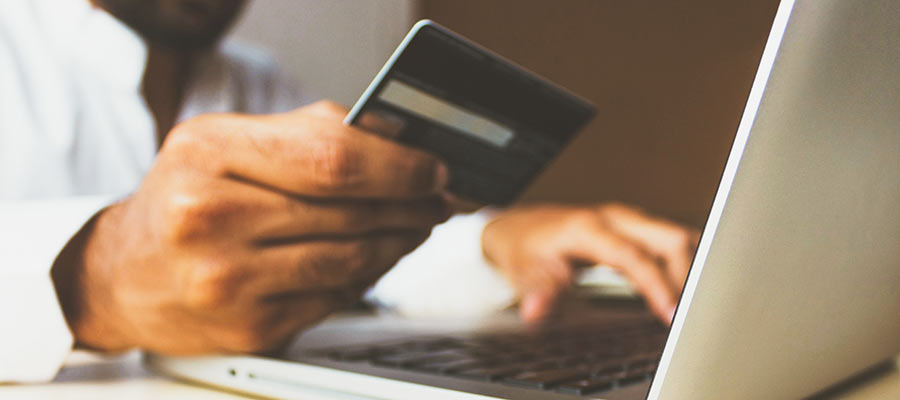 A person holding a credit card.