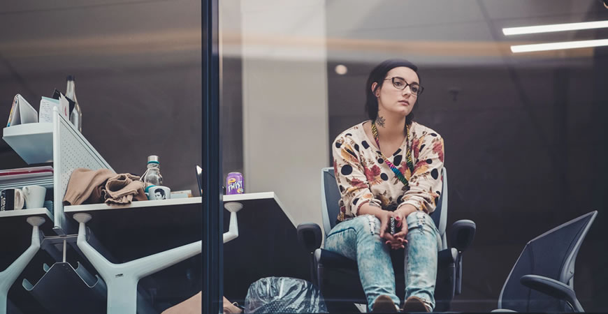 Woman window working looking out work bored