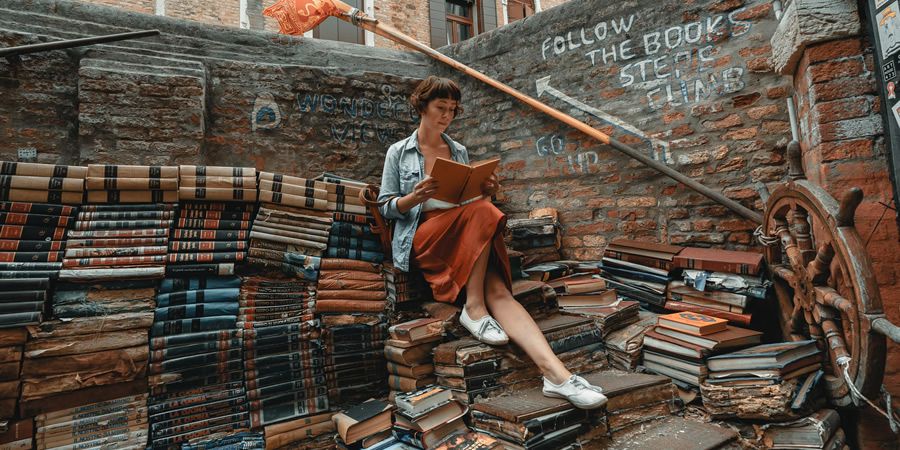 A person writing in a notebook.